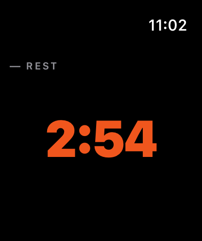 The Apple Watch app resting between sets: a large countdown reading two minutes fifty-four.